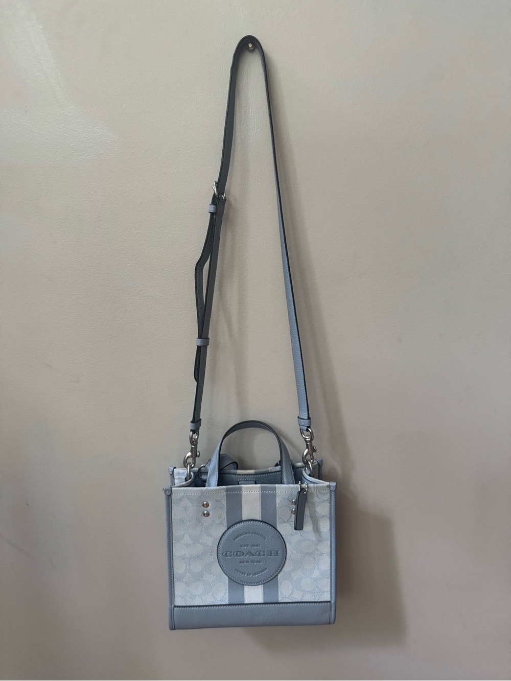 Coach Dempsey 22 Signature Stripe Crossbody Tote in Light Grayish Blue.